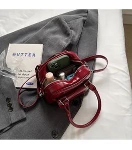 Interior view of burgundy leather Boston bag showing spacious storage for daily essentials
