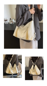 Creamy leather tote bag showing versatile shoulder and backpack carrying options