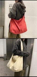Detailed comparison of red and off-white large canvas tote bags with wide straps