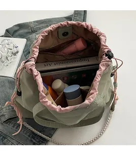Internal view of canvas tote showing pink lining with zipper pocket and spacious capacity