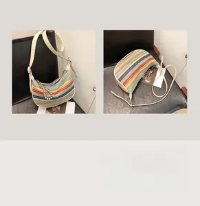 Detailed view of rainbow striped woven crossbody bag with pearl chain and adjustable strap