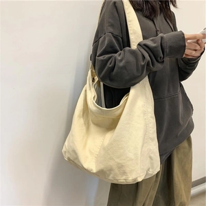 Minimalist beige canvas hobo crossbody bag for students featuring large capacity