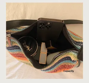 Internal view showing capacity for smartphone and cosmetics in rainbow straw bag
