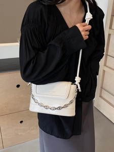 Chic cream white bucket bag with silver chain and braided strap detail for women