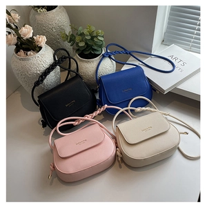 Saddle crossbody bags in four colors with textured leather and woven rope straps