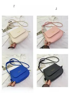 Four saddle-shaped crossbody bags in off-white, pink, blue, and black with woven straps