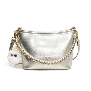 Silver wrinkled leather bucket bag with braided chain handle and plush charm detail