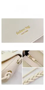 Macro detail of creamy white lychee grain leather crossbody bag with gold-tone hardware