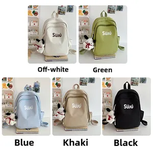 Collage of five colorful nylon backpacks with cute plush pendants for casual travel