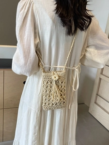Handmade woven phone crossbody bag with tassel detail for summer beach vacations
