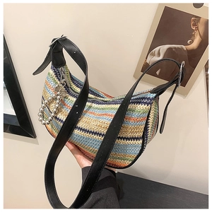 Detail of multi-color striped woven beach bag with beaded ring zipper and leather strap