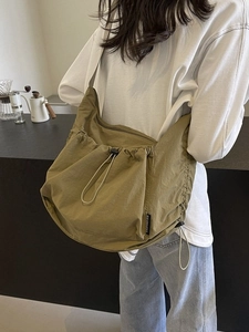 Large capacity army green nylon tote bag with drawstring detail for women's daily commute