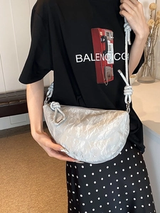 Silver metallic wrinkled faux leather half-moon crossbody bag with knot strap detail