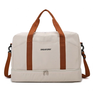 Sac de voyage beige grande capacité avec compartiment à chaussures et anses orange