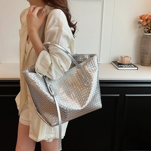 Silver woven tote bag with metallic finish and large capacity for daily commuting