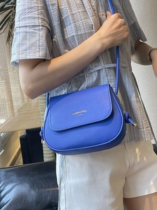 Blue semi-circular fashion crossbody bag in synthetic leather with golden lettering