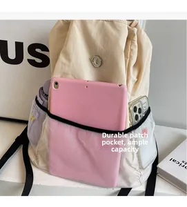 Detail showing high-capacity interior with mesh pocket for tablet, phone and umbrella