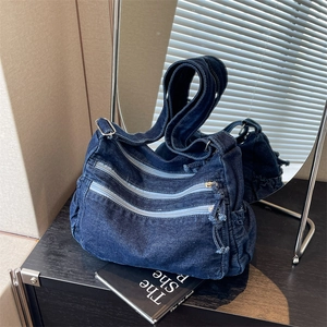 Fashionable dark blue washed denim crossbody tote bag with multi-zipper compartments
