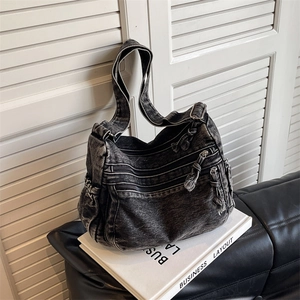 Deep grey washed denim tote bag with multiple zip pockets and adjustable strap