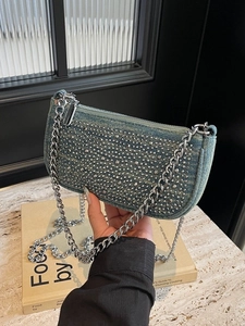 Retro denim shoulder bag with silver studs and metal chain strap in Y2K style