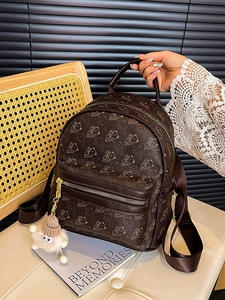 Mini brown leather backpack with vintage bear print and cute plush charm detail