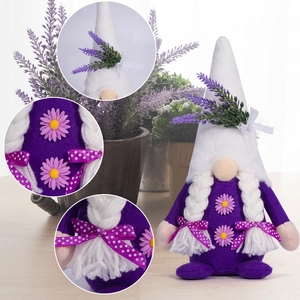 Detail view of purple lavender gnome plush with white braids and daisy accents