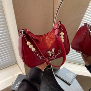 Red half-moon underarm bag with silver butterfly clasp and pearl flower chain strap