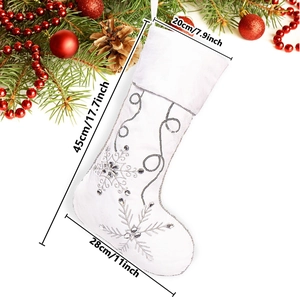 White plush Christmas stocking with silver embroidered snowflakes and sequins for holidays