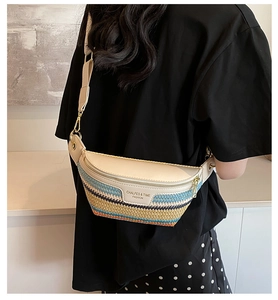 Detailed back view of a colorful woven crossbody bag with adjustable beige strap