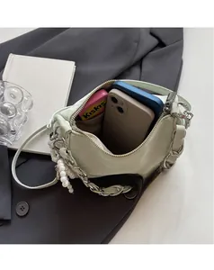 Top view of mint green handbag interior showing spacious capacity for phones and snacks