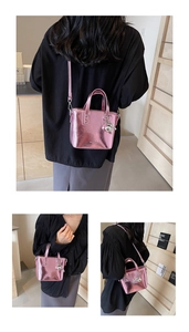 Detail of metallic pink mini tote with ruffled texture and silver bear charm