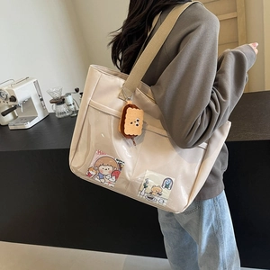 Large capacity nylon tote bag in cream with transparent PVC pocket and cute plush charm