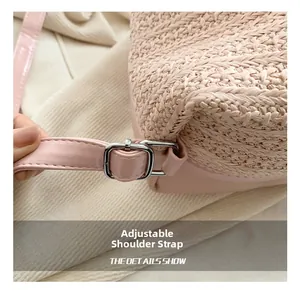 Close-up of the adjustable silver buckle and woven strap on this pink summer backpack