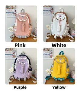 Minimalist nylon backpacks in four pastel colors with plush cloud charms and top handles