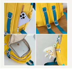 Detail view of yellow nylon backpack featuring side pockets and tablet storage compartment