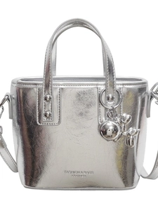 Silver metallic bucket bag with crinkled texture, top handles and balloon dog charm
