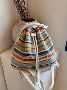 Colorful striped woven backpack with cream leather straps and drawstring for travel