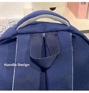 Detail of blue backpack with reinforced padded top handle and mesh breathable lining