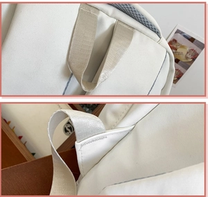 Detailed close-up of heavy-duty canvas backpack handle with reinforced nylon stitching