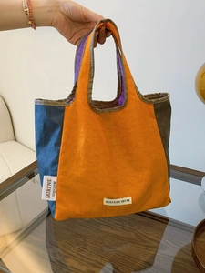 Minimalist large-capacity canvas tote bag in orange and blue color-block design