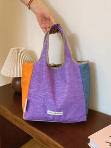 Minimalist color-block tote bag in purple, orange, and blue with casual nylon texture