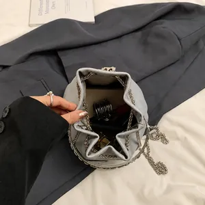 Top view of bucket bag interior showing spacious storage for phone and lipstick