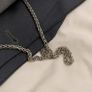 Macro shot of high-quality silver metal chain strap with fine woven texture and metallic luster