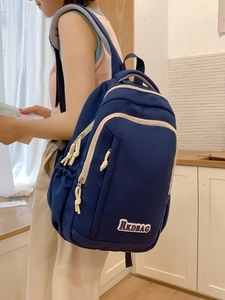 Minimalist navy canvas backpack for women with white zipper details and RKDBAG embroidery