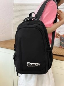 Minimalist black multi-compartment school backpack for students and daily travel use
