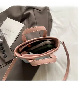 Pink faux leather tote bag with large interior capacity and removable shoulder strap