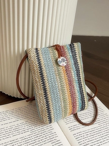 Colorful striped straw woven crossbody bag with brown rope strap and floral button detail