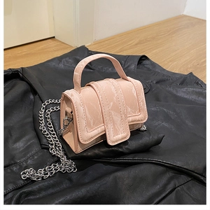 Detail of pink marble pattern mini crossbody bag with silver chain strap and curved handle