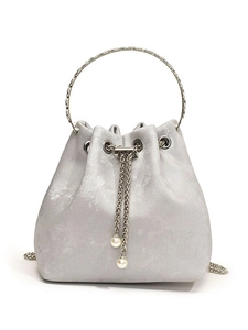 Silver satin bucket bag with round metal handle and elegant pearl drawstring detail