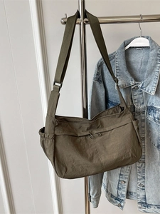 Olive green nylon large capacity crossbody bag with front zipper and side pocket